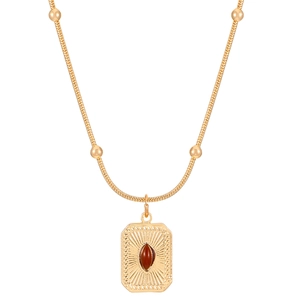 Gold vintage tiger eye necklace with square pendant and snake chain on white background