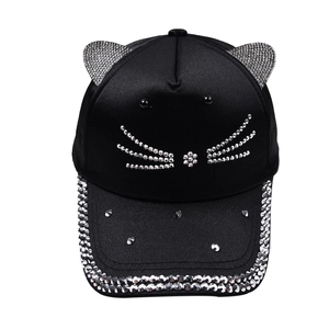 Detail of black baseball cap with rhinestone cat ears and sparkling whiskers design