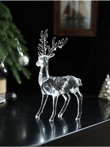 Macro shot of a transparent acrylic reindeer sculpture with a crystal-like texture