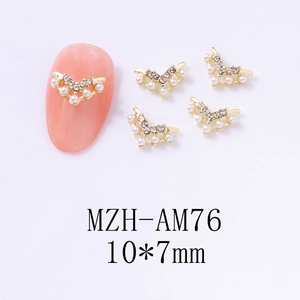 V-shaped gold alloy nail charms with micro pearls and rhinestones on orange nail
