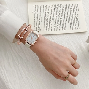 Elegant rose gold square watch with white leather strap and matching diamond bracelet set