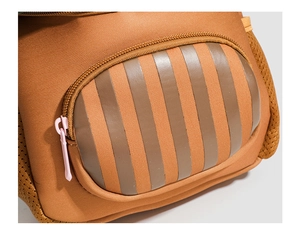 Close-up of brown fabric texture and pink zipper on a lightweight children backpack