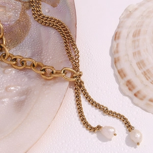 Detail of 18K gold-plated double-layer Cuban chain necklace with freshwater pearls