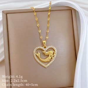Detailed view of gold mermaid heart pendant with crystals and product specifications