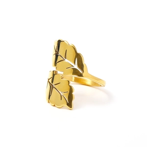 Detail of 18k gold leaf ring showing hollow vein textures on polished titanium steel surface