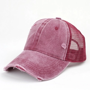 Detail of distressed cotton trucker hat with mesh back and vintage washed finish