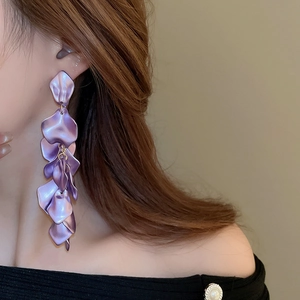 Detail showing tiered lilac purple petal long tassel earrings with silky matte texture