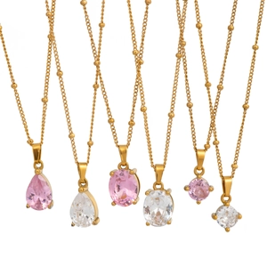 Gold beaded necklaces with pink and clear oval, teardrop, and round zircon pendants