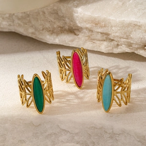 French vintage gold plated stainless steel rings with oval stones in green pink and blue