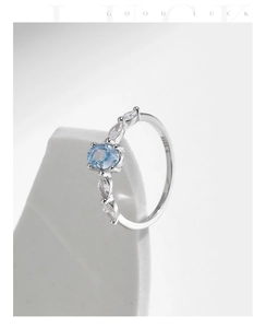 Detail of S925 silver ring featuring blue crystal and S925 hallmark engraving