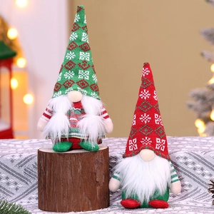 Detailed view of two handmade Christmas Swedish gnomes with knitted hats and white beards