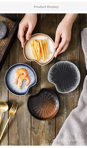 Ceramic appetizer plates set with varied glazes and unique scalloped irregular edges