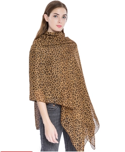 Detailed view of large brown leopard print lightweight chiffon scarf worn as a wrap