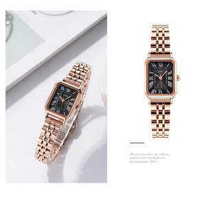 Detail view of square women watch with black dial and rose gold stainless steel band