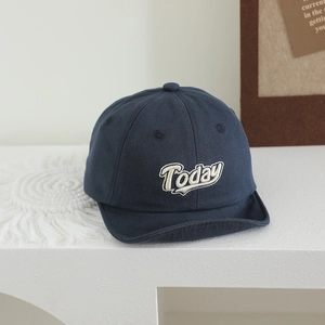 Close-up of navy cotton baby baseball cap with white Today embroidery and soft brim
