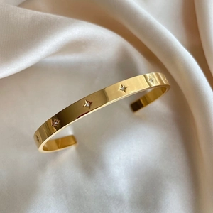 18k gold plated stainless steel cuff bracelet with sparkling starburst cubic zirconia