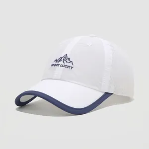Detail of white kids baseball cap featuring mountain embroidery and breathable mesh side panels