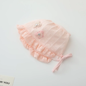 Detailed view of baby girl pink lace sun hat with 3D butterfly applique and ruffled brim