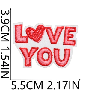 Macro view of Love You embroidery patch with ruler showing dimensions 3.9cm by 5.5cm