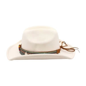Close-up of white western cowboy hat featuring ethnic braided band and beaded tassel detail