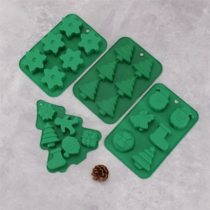 Juego de 4 moldes de silicona verde para Navidad con copos, árboles y hombre de jengibre