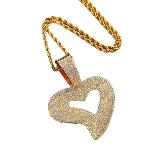 Hip hop style gold heart pendant necklace with shimmering crystals on a twisted chain