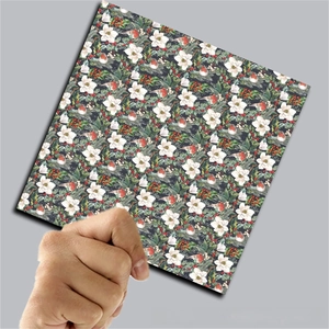 Detail of vintage Christmas scrapbook paper with magnolia flowers and red berries
