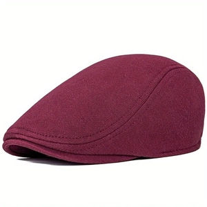 Classic burgundy knit ivy cap in vintage British style with a rounded brim and neat stitching