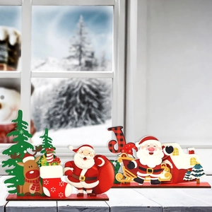 Wooden Christmas table decorations set featuring Santa Claus and snowman on winter windowsill