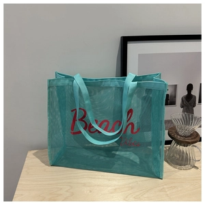 Mint green mesh tote bag with Beach Vibes print for travel and beach use