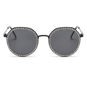 Fashionable oversized round sunglasses with rhinestone borders and dark gray lenses