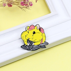 Creative enamel pin of a cute yellow hamster eating sunflower seeds with pink backpack
