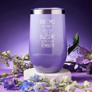 Close-up of a gradient purple stainless steel tumbler with fine matte glitter texture
