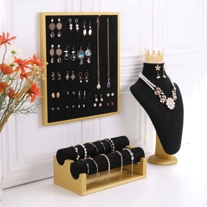 Elegant black velvet and gold jewelry display stands set for necklaces and bracelets