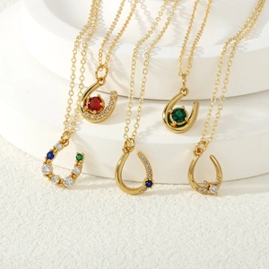 U-shaped gold necklace with colorful zircon stones including red, green, blue and white crystals