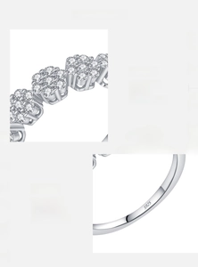 Detailed close-up of S925 hallmark on silver flower ring with sparkling zircons