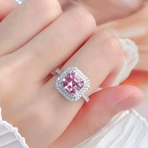 Close-up of luxury square pink cubic zirconia ring with double halo pavé setting