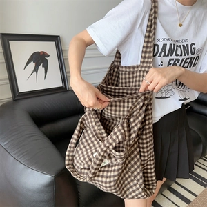 Detail shot showing the large capacity and spacious interior of the plaid tote bag