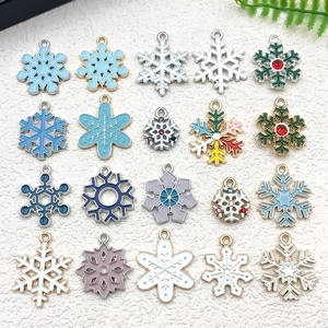 Detailed grid of 20 colorful enamel snowflake charms for DIY jewelry making and crafts