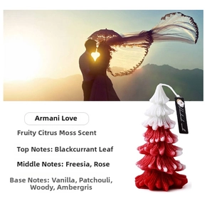 Macro shot of red and white gradient Christmas tree candle with a handmade hanging tag