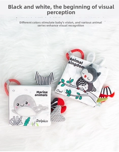 Detail of baby soft books with textured animal tails and sensory tags for newborn vision