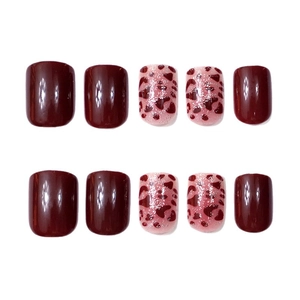 Short square press-on nails set in wine red and pink leopard print patterns
