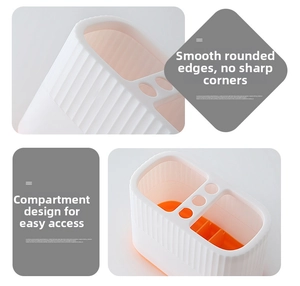 Detail of white and orange desk organizer showing rounded corners and multi-grid storage