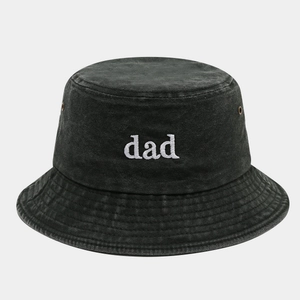 Close-up of dad embroidery and metal eyelets on vintage washed dark grey bucket hat