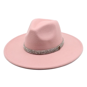 Detail of pink fedora hat with rhinestone band and gold M logo on wide brim