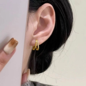 Crossed double hoop gold plated earrings with white cubic zirconia for women