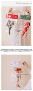 Detailed view of transparent Christmas gift bag with festive Santa prints and nylon handles