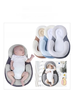 Detail of portable baby sleep positioner showing U-shape pillows and mesh fabric