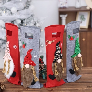 Christmas gnome wine bottle gift bags made of felt and sequins for holiday table decor