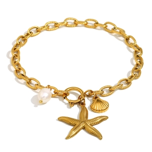 Gold stainless steel starfish and pearl anklet jewelry with charms on white background